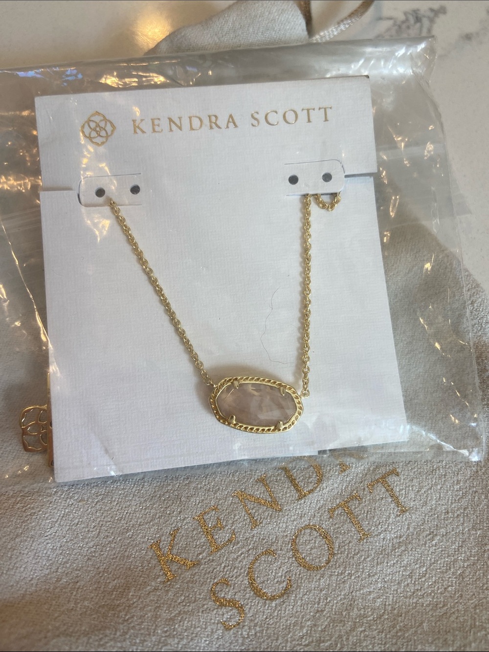 Kendra Scott Gold Necklace with Rose Quartz Oval Pendant